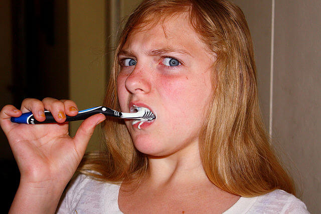 difficulty brushing teeth